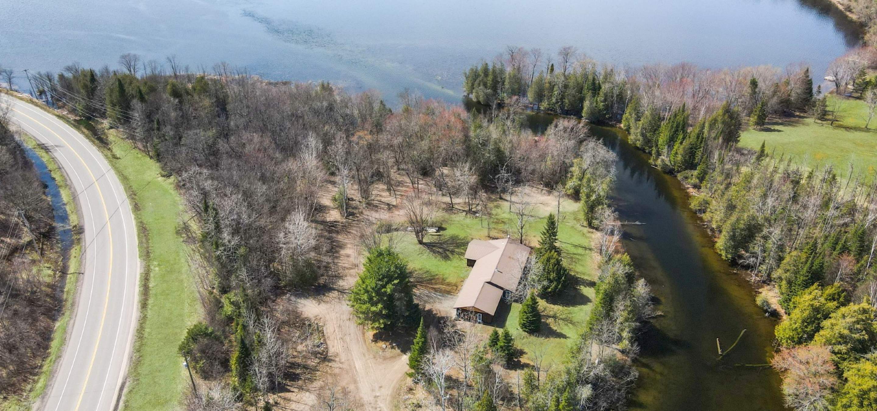 aerial view of the home showing the river and the lake.