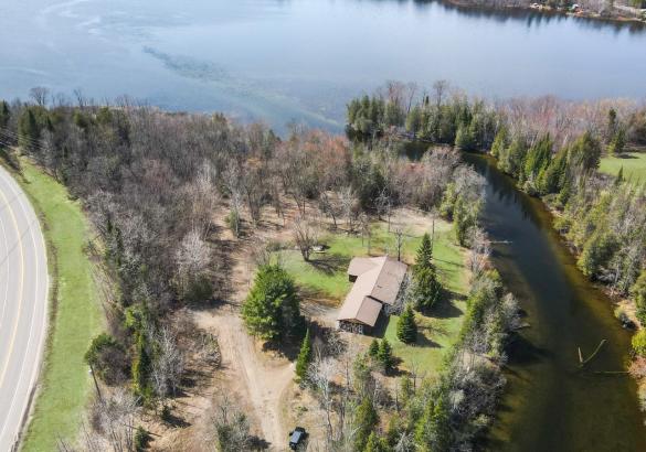 aerial view of the home showing the river and the lake.